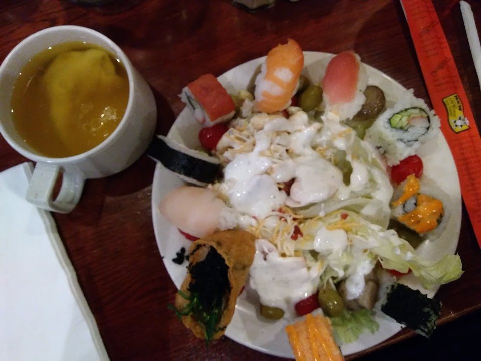 Salad with Sushi Ringing the Sides